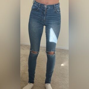 Dark blue distressed jeans